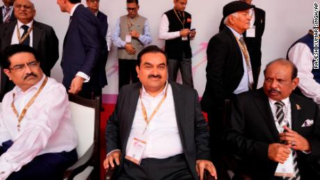 Industrialist Gautam Adani, center, sits for a group photograph during the Ground Breaking Ceremony @3.0 of the UP Investors Summit Lucknow in the northern Indian state of Uttar Pradesh, India, on June 3.