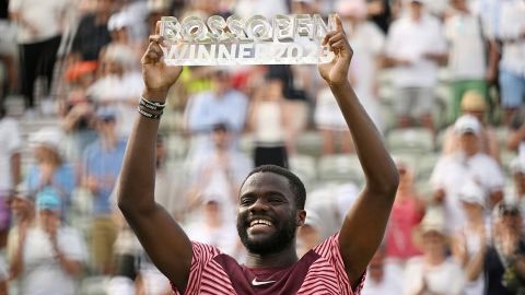 United States' Frances Tiafoe holds up the trophy after winning the final match of the Stuttgart Open against Germany's Jan-Lennard Struff, in Stuttgart, Germany, Sunday, June 18, 2023.