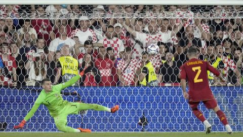 Spain's Dani Carvajal scores the winning penalty past Croatia goalkeeper Dominik Livakovic during a penalty shootout at the end of the Nations League final soccer match between Croatia and Spain at De Kuip stadium in Rotterdam, Netherlands, Sunday, June 18, 2023. Spain won 5-4 in a penalty shootout after the match ended tied 0-0. (AP Photo/Peter Dejong)