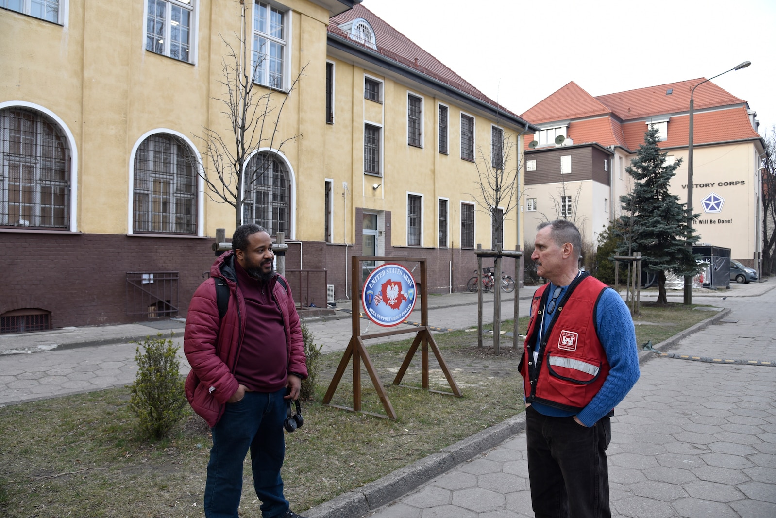 U.S. Army Corps of Engineers, Europe District Project Engineer Israel Miller and Area Engineer August Carrillo discuss ongoing construction projects in Poland by recently renovated administrative facility on the Polish Army base in Poznan, Poland March 16, 2022. Europe District’s Northern Europe Area Office on the base in Poland manages construction projects at several Polish military sites across the country. (U.S. Army photo by Chris Gardner)