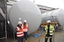 U.S. Army Corps of Engineers, Europe District Quality Assurance Engineer Jüri Saljukov, a local Estonian national employee, discusses progress with a local contractor at the ongoing construction of a bulk fuel storage facility at Amari Air Base in Estonia May 12, 2022. Over the past several years, the U.S. Army Corps of Engineers has delivered various projects in Estonia and neighboring Baltic countries Latvia and Lithuania through the European Deterrence Initiative where military infrastructure is built to enhance the U.S. deterrence posture, increase the readiness and responsiveness of U.S. forces in Europe, support the collective defense and security of NATO allies, and bolster the security and capacity of U.S. allies and partners. (U.S. Army photo by Chris Gardner)