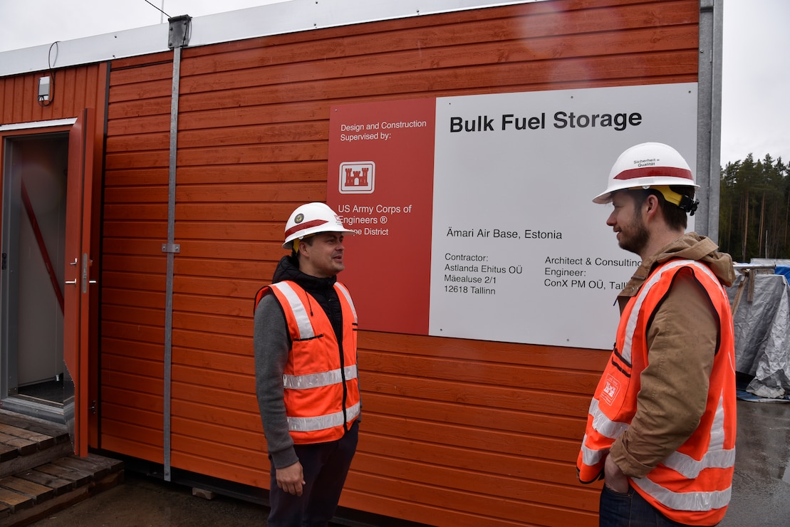 U.S. Army Corps of Engineers, Europe District Quality Assurance Engineer Jüri Saljukov and Project Engineer Chris Bailey discuss progress on a bulk fuel storage facility under construction at Amari Air Base in Estonia May 12, 2022. Over the past several years, the U.S. Army Corps of Engineers has delivered various projects in Estonia and neighboring Baltic countries Latvia and Lithuania through the European Deterrence Initiative where military infrastructure is built to enhance the U.S. deterrence posture, increase the readiness and responsiveness of U.S. forces in Europe, support the collective defense and security of NATO allies, and bolster the security and capacity of U.S. allies and partners. (U.S. Army photo by Chris Gardner)