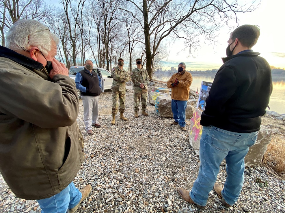 IN THE PHOTOS, Project Manager Mark Mazzone briefs Memphis District Commander Col. Zachary Miller and other district leadership on the details of the Hopefield project at the exact site where the armoring took place. Afterward, the group walked down to the riverbank to cut the ribbon, symbolizing the victory and celebration of completing yet another significant project. (USACE photos by Jessica Haas)