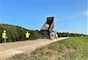 IN THE PHOTO, A Rock Construction works to resurface the levee crown near Phillips County, Arkansas. 2019 flood damage supplemental funds funded the project.