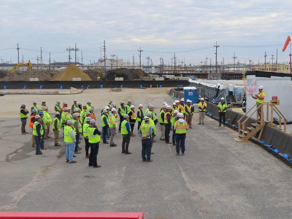 District Commander addresses a large team of contractors at a construction site