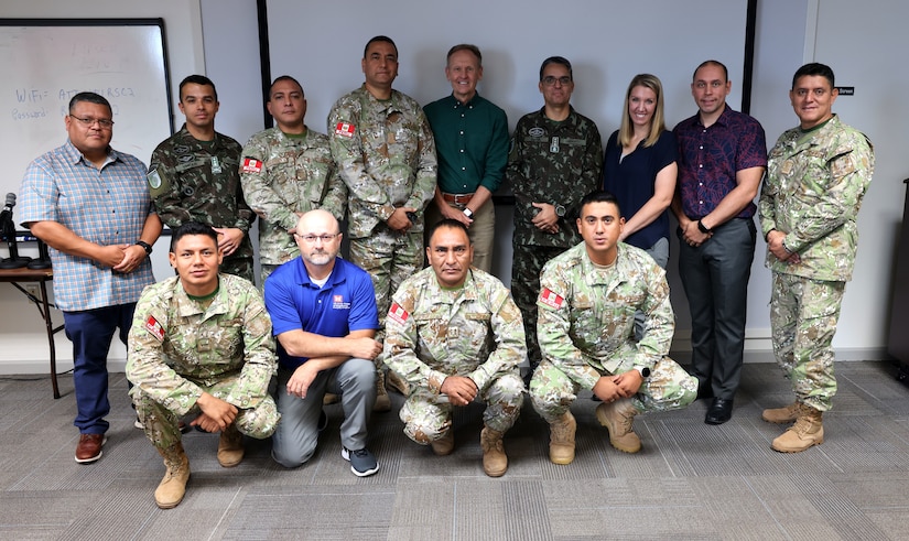 Participants in the Multi-Lateral Disaster Lessons Learned Workshop pose for a class photo at the Readiness Support Center, Mobile, Alabama, June 13, 2023. The workshop, which was hosted by the Mobile District, allowed participants from U.S. Army South, Peru, Chile, and Brazil to share how they approached and dealt with emergency disasters in their countries. (U.S. Army photo by Chuck Walker)