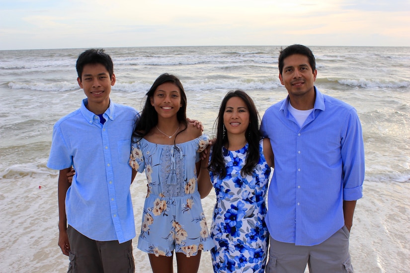 During a vacation to Florida, Phanna Cea (second from right) and her husband, Cesar Cea (right) along with their son and daughter on the beach March 30, 2023.