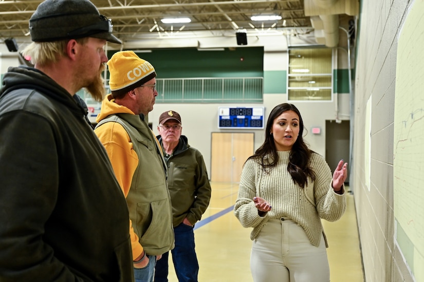 Omaha District Senior Realty Specialist, Paige Staroscik talks with landowners and local community members at Pine Bluffs Community Center, March 27, 2023. The U.S. Air Force partnered with USACE held a county meeting for the local public in Pine Bluffs, WY to discuss upcoming real estate acquisitions in the area.