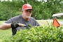 Tim and Margie Carter help with various tasks, like landscaping, to help maintain the property at Patoka Lake in exchange for being able to park and connect their 38-foot camper there.