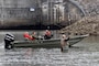 Park Ranger Gary Bruce maneuvers a Corps of Engineers boat into position Nov. 2, 2021 to allow an Open Jaw Productions film crew to obtain imagery of Lee Chadwell fly fishing in the Caney Fork River below Center Hill Dam in Lancaster, Tennessee. Trout fishing is a popular recreation activity in the tailwater at the project operated and maintained by the U.S. Army Corps of Engineers Nashville District. The imagery is being used for a USACE National Inventory of Dams video production. (USACE Photo by Lee Roberts)