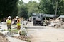 Robert Burick (Left), emergency management specialist with the Louisville District, and Mitchell Green, maintenance worker with the Kansas City District, both with the U.S. Army Corps of Engineers debris response team, observe debris operations Sept. 3, 2021 in Waverly, Tennessee. They are providing technical assistance following deadly flooding in Tennessee when up to 17 inches of rain fell in the region Aug. 21. (USACE Photo by Lee Roberts)