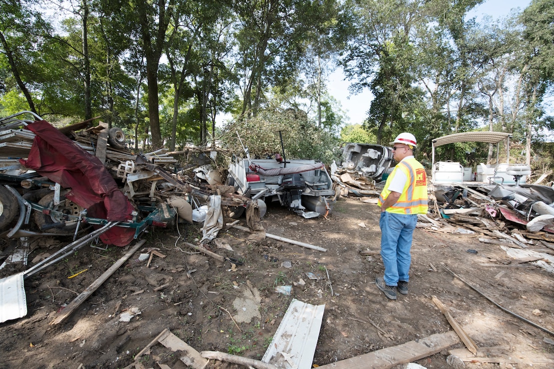 Robert Powers, lead debris subject matter expert and construction representative with the Baltimore District, observes a debris field Sept. 3, 2021 near Trace Creek in Waverly, Tennessee.  Powers is leading a Corps of Engineers' debris technical assistance team in Tennessee following deadly flooding when up to 17 inches of rain fell in the region Aug. 21. (USACE Photo by Lee Roberts)