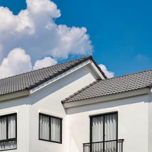 The upper floor of a house and its shingled roof