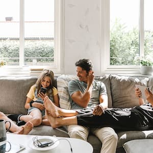 happy family sitting on the sofa in the living room