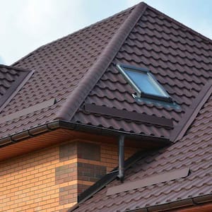 A brick house with a metal roof