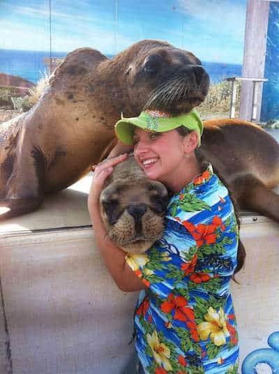 Gala hugging sea lions juggling