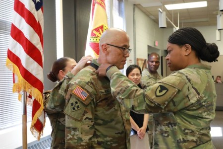 FORT CARSON, Colo. — Col. Monica Lawson, right, command chaplain, U.S. Army Installation Management Command, and Chaplain Corps Regimental Sgt. Maj. Meaghan Simmons, present the Martin of Tours Medal to Sgt. 1st Class David Hong, a U.S. Army Garrison Fort Carson religious affairs noncommissioned officer, Sept. 8, 2023, at Fort Carson. 