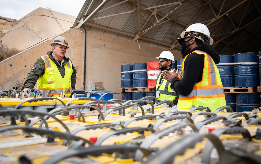 Greg Nivens (left), an environmental advisor, assigned to U.S. Army Corps of Engineers Transatlantic Division's Expeditionary District, inspect the hazardous waste storage site on Al Asad Air Base, in Iraq, Feb. 8, 2022. (US Army photo by Richard Bumgardner)