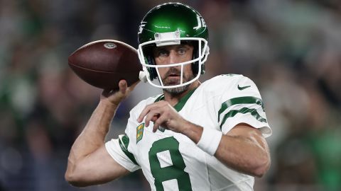 New York Jets quarterback Aaron Rodgers (8) warms up before playing against the Buffalo Bills in an NFL football game, Monday, Sept. 11, 2023, in East Rutherford, N.J. (AP Photo/Adam Hunger)