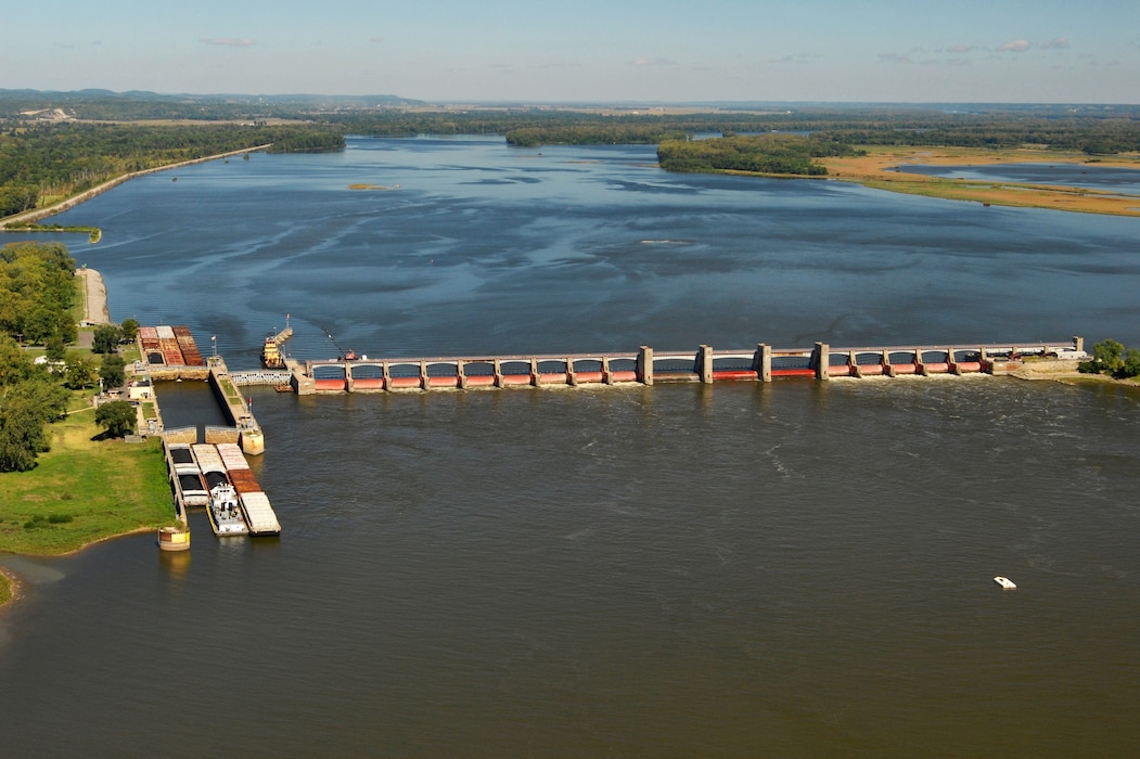 Lock and Dam 25 is located in Calhoun County, Illinois, and Lincoln County, Missouri, at approximately Mile 241.4 on the Upper Mississippi River above the mouth of the Ohio River near Winfield, Missouri.   

Proposed project features include construction of new 1200-foot, pile founded, lock located in the auxiliary miter gate bay, and construction of an upstream, ported guard wall totaling 1200 feet, and a 650-foot downstream approach wall. The existing 600-foot lock remains in place and will become auxiliary lock chamber to be used primarily by recreation traffic. The project also includes associated channel work, relocations and site-specific environmental mitigation. 

The majority of the Upper Mississippi River locks were designed and constructed in the 1930’s and the lock chambers are 600-ft. long. The 600-ft. lock chamber cause significant average delays to navigation because of double lockages required for tows larger than 600-ft.The new1200-foot lock will significantly reduce delays and increase safety.

The combination of ecosystem and navigation in a single U.S. Army Corps of Engineers program required many years of coordination with both the navigation and ecosystem partners and it will alter the future of the Upper Mississippi River System to ensure it remains the vital transportation and ecosystem corridor for the next 100 plus years.