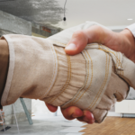 Contractor and homeowner shake hands