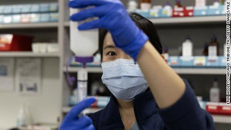 Inpatient pharmacist Selena Ko reconstitutes powered antibiotic amoxicillin and measures doses for pediatric patients on Nov. 10, 2022, at Rush University Medical Center in Chicago. (Erin Hooley/Chicago Tribune/Tribune News Service via Getty Images)