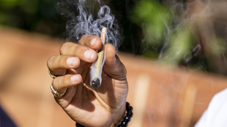 A customer smokes marijuana at the Lowell Cafe, a new cannabis lounge in West Hollywood, California, U.S., on Tuesday, Oct. 1, 2019. America's first cafe to allow the consumption of cannabis offers an extension to the market, where sales are largely confined to dispensaries and online orders, and tests the appetite for a more open and public consumption of a product that's still illegal in many jurisdictions. Photographer: Kyle Grillot/Bloomberg via Getty Images