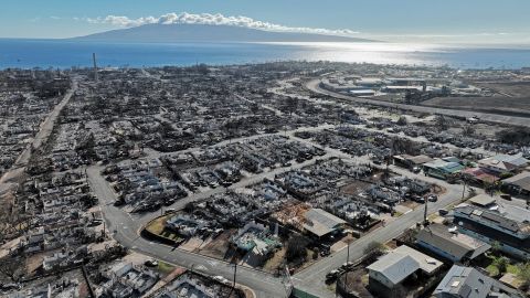 LAHAINA, HAWAII - AUGUST 17: In an aerial view, burned cars and homes are seen a neighborhood that was destroyed by a wildfire on August 17, 2023 in Lahaina, Hawaii. At least 111 people were killed and thousands were displaced after a wind driven wildfire devastated the towns of Lahaina and Kula early last week. Crews are continuing to search for missing people. (Photo by Justin Sullivan/Getty Images)