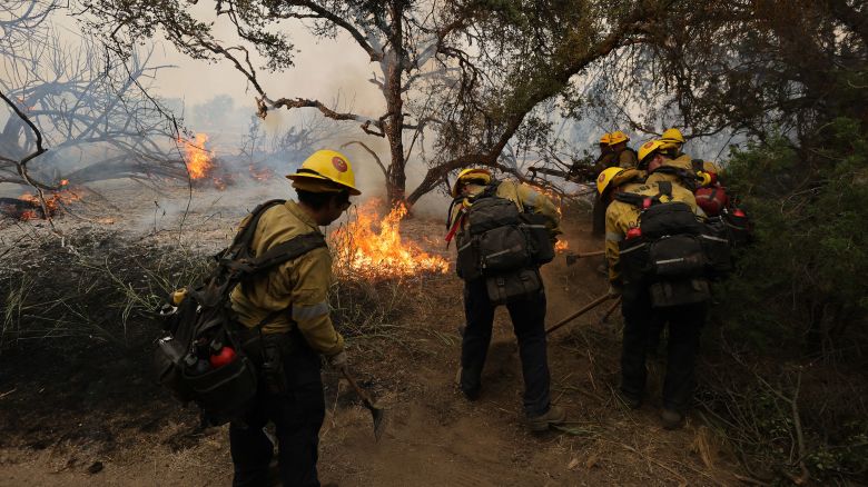 Firefighters clear the area to control the Gavilan Fire, which has already burned more than 250 acres in Perris, Riverside County, California, on July 15, 2023. Brutally high temperatures threatened tens of millions of Americans July 15, as numerous cities braced to break records under a relentless heat dome that has baked parts of the country all week.
The National Weather Service warned of an "extremely hot and dangerous weekend," with daytime highs reaching up to 116 Fahrenheit (47 degres celsius). (Photo by DAVID SWANSON / AFP) (Photo by DAVID SWANSON/AFP via Getty Images)