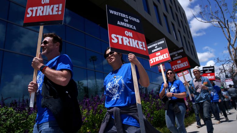 Striking Writers Guild of America workers picket outside the Sunset Bronson Studios building on May 2, 2023 in Los Angeles, California. After talks with studios and streamers over pay and working conditions failed to result in a deal, more than 11,000 Hollywood television and movie writers went on their first strike in 15 years. Late-night shows are expected to stop production immediately, while television series and movies scheduled for release later this year and beyond could face major delays. 