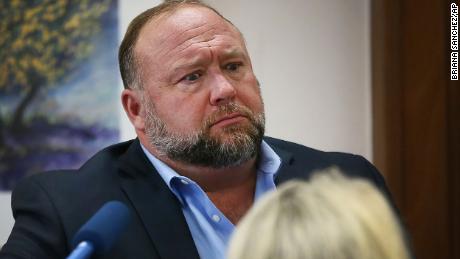 Conspiracy theorist Alex Jones attempts to answer questions about his emails asked by Mark Bankston, lawyer for Neil Heslin and Scarlett Lewis, during trial at the Travis County Courthouse in Austin, Wednesday Aug. 3, 2022. Jones testified Wednesday that he now understands it was irresponsible of him to declare the Sandy Hook Elementary School massacre a hoax and that he now believes it was &quot;100% real.&quot; (Briana Sanchez/Austin American-Statesman via AP, Pool)