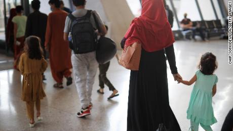 Refugees arrive at Dulles International Airport after being evacuated from Kabul following the Taliban takeover of Afghanistan August 27, 2021 in Dulles, Virginia. 