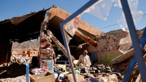 Ait Abdellah Brahim, 86, sits among rubble, in the aftermath of a deadly earthquake, in Talat N'Yaaqoub, Morocco, September 16, 2023. REUTERS/Ammar Awad