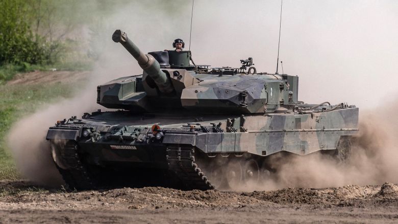 This picture taken on May 19, 2022 shows soldiers on a Polish Leopard tank as troops from Poland, USA, France and Sweden take part in the DEFENDER-Europe 22 military exercise, in Nowogard, Poland. - Poland's Defence Minister Mariusz Blaszczak on January 24, 2023 said Warsaw had asked Germany for permission to send its German-made Leopard tanks to Ukraine. - ALTERNATIVE CROP (Photo by Wojtek RADWANSKI / AFP) / ALTERNATIVE CROP (Photo by WOJTEK RADWANSKI/AFP via Getty Images)