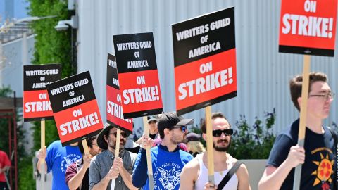 Writers picket in front of Netflix on Sunset Boulevard in Hollywood, California, on May 2, 2023 as the Writers Guild of American (WGA) goes on strike. - More than 11,000 Hollywood television and movie writers went on their first strike in 15 years, after talks with studios and streamers over pay and working conditions failed to clinch a deal. The strike means late-night shows are expected to grind to a halt immediately, while television series and movies scheduled for release later this year and beyond could face major delays.