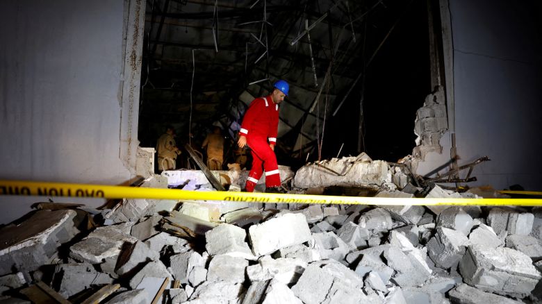 An emergency worker walks over rubble at the site following a fatal fire at a wedding celebration, in the district of Hamdaniya in Iraq's Nineveh province, Iraq, September 27, 2023. REUTERS/Khalid Al-Mousily     TPX IMAGES OF THE DAY     