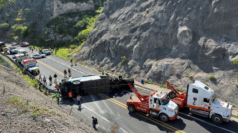 Tow trucks and authorities work at the area of a road accident, which left over a dozen passengers dead, in Tepelmeme Villa de Morelos, in Oaxaca state, Mexico August 22, 2023. REUTERS/Jose de Jesus Cortes