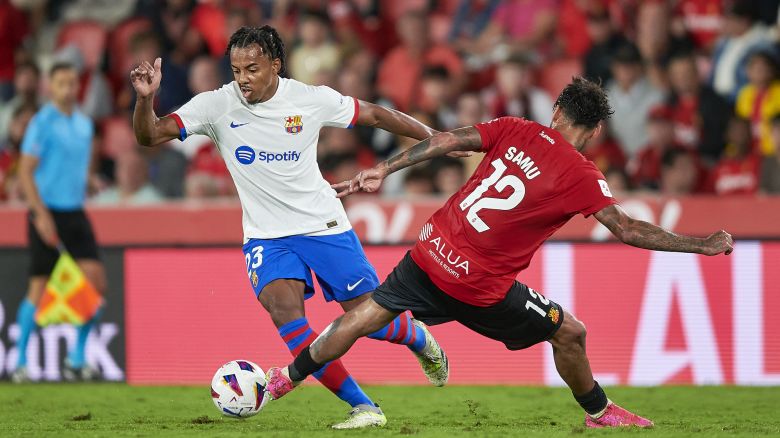 MALLORCA, SPAIN - SEPTEMBER 26: Samu Costa of RCD Mallorca competes for the ball with Jules Kounde of FC Barcelona during the LaLiga EA Sports match between RCD Mallorca and FC Barcelona at Estadi de Son Moix on September 26, 2023 in Mallorca, Spain. (Photo by Cristian Trujillo/Quality Sport Images/Getty Images)