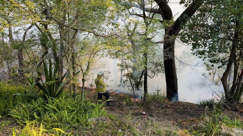 New South Wales Rural Fire Service firefighter Elisabeth Goh monitors a hazard reduction burn in Sydney, Australia, September 10, 2023. REUTERS/Cordelia Hsu