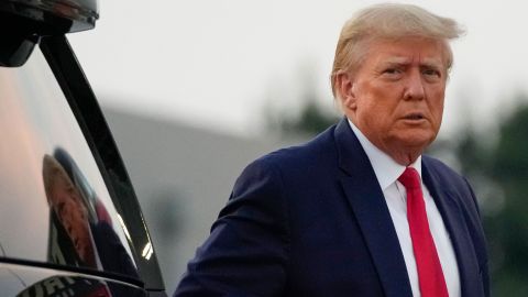 Former President Donald Trump walks to speak with reporters before departure from Hartsfield-Jackson Atlanta International Airport, Thursday, Aug. 24, 2023, in Atlanta. (AP Photo/Alex Brandon)