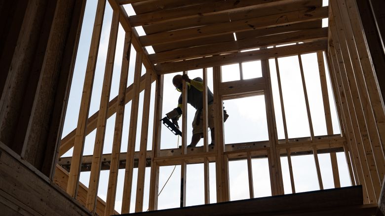 A worker builds a home in Lillington, North Carolina, US, on Thursday, June 15, 2023. 