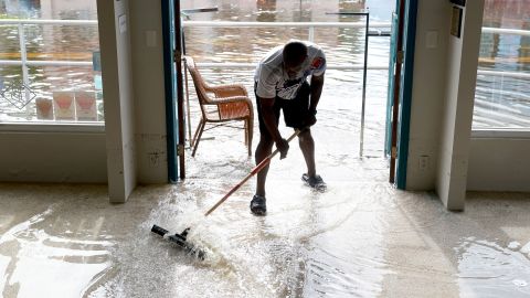 CRYSTAL RIVER, FLORIDA - AUGUST 30: Donnye Franklin helps a friend try to get the flood waters out of his Explorer Manatee Tour store after Hurricane Idalia passed offshore on August 30, 2023 in Crystal River, Florida. Hurricane Idalia hit the Big Bend area on the Gulf Coast of Florida as a Category 3 storm. (Photo by Joe Raedle/Getty Images)