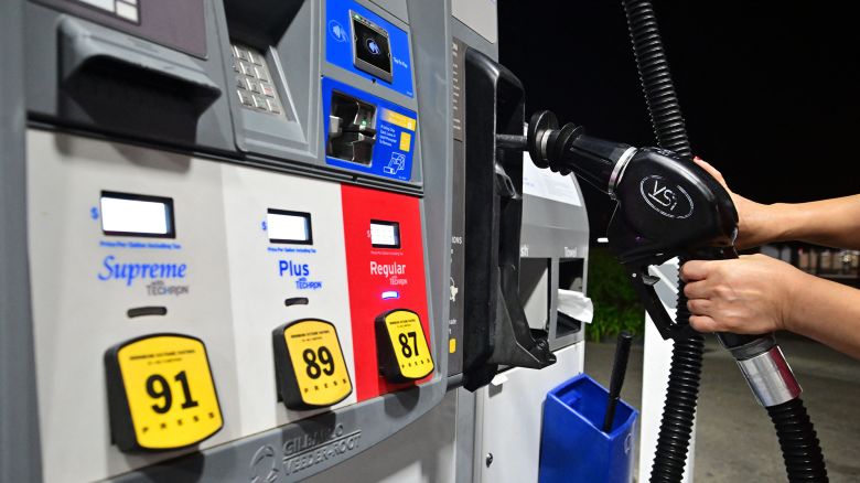 A nozzle is replaced on a fuel dispenser at a gas station in La Puente, California, on September 7, 2023. 