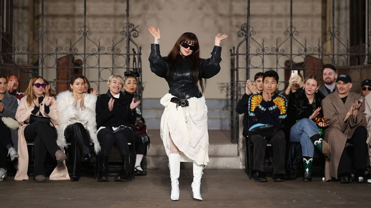 Designer, Dilara Findikoglu waves on the runway at the Dilara Findikoglu show during London Fashion Week February 2023 on February 20, 2023 in London, England.