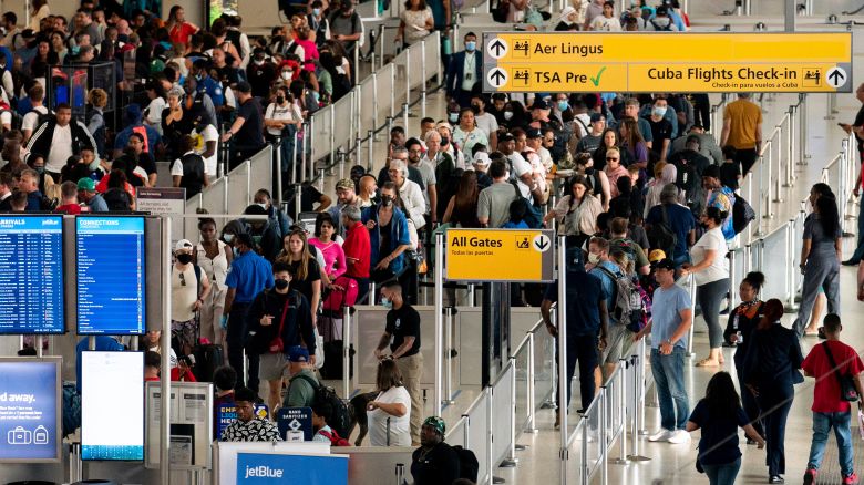 FILE - People wait in a TSA line at the John F. Kennedy International Airport on June 28, 2022, in New York. Facing a shortage of air traffic controllers, the Federal Aviation Administration said Wednesday, Aug. 9, 2023, that it will let airlines continue to limit flights in the New York City area into October without penalties that they would normally face for such reductions. (AP Photo/Julia Nikhinson, File)