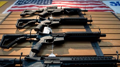 Assault rifles hang on the wall for sale at Blue Ridge Arsenal in Chantilly, Virginia, on October 6, 2017.