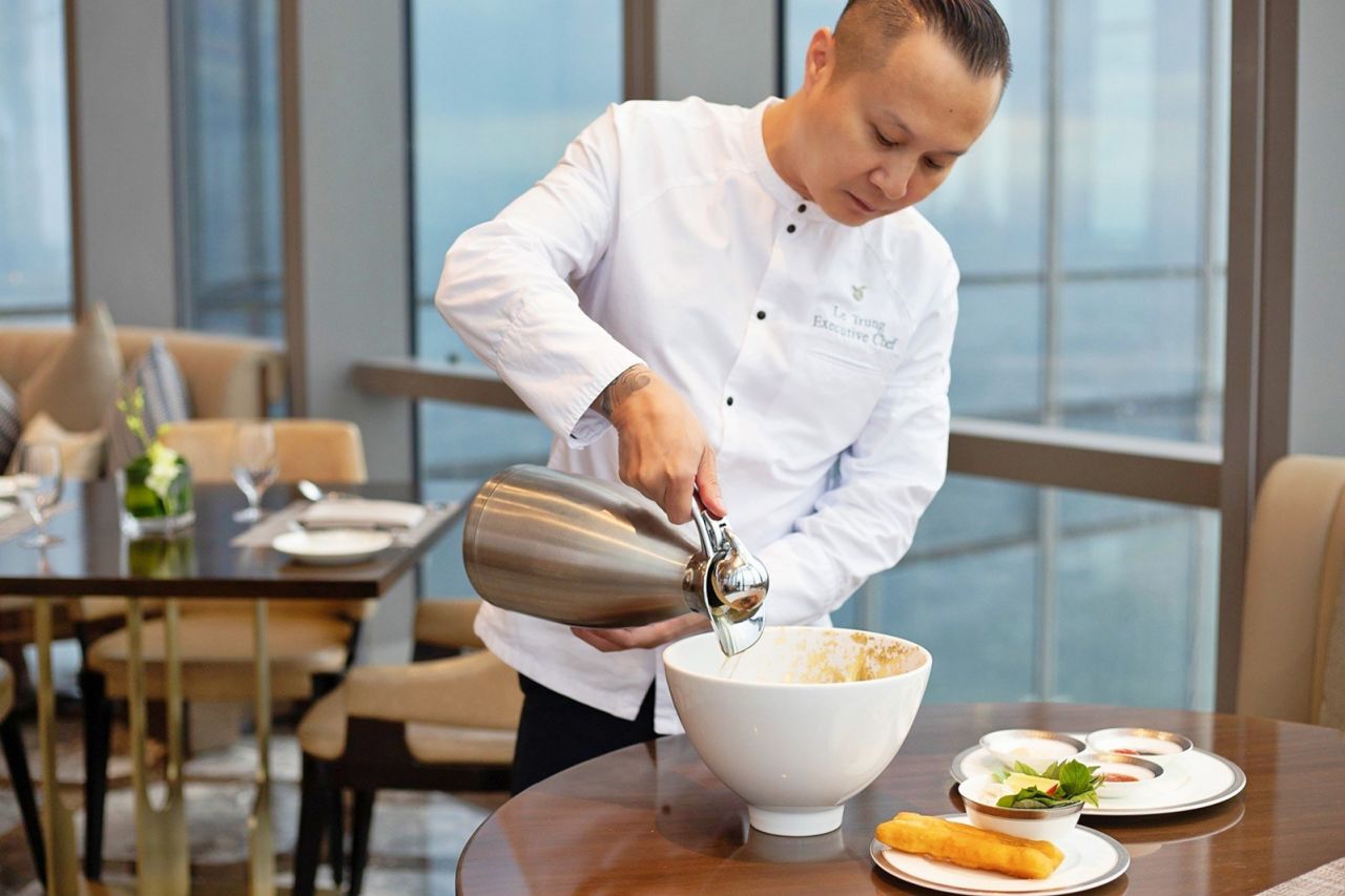 Chef Trung puts the finishing touches on the pho.