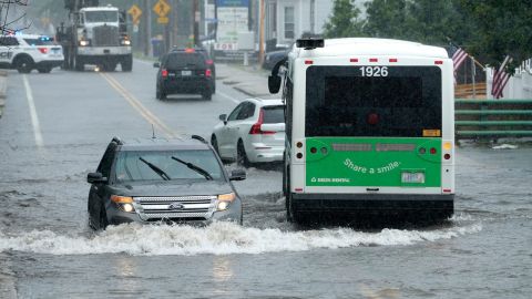 Monday afternoon downpours flood portions of Douglas Ave in front of the North Providence Marketplace forcing a temporary closing of the section of road on July 10, 2023, in North Providence, Rhode Island.