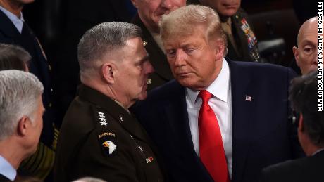 In this February 2020 photo, Chairman of the Joint Chiefs of Staff Gen. Mark Milley chats with President Donald Trump after he delivered the State of the Union address at the Capitol in Washington, DC.