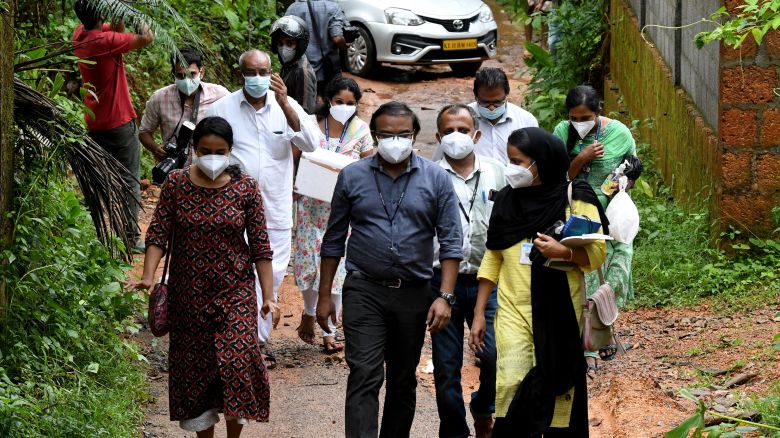 A medical team from Kozhikode Medical College carry areca nut and guava fruit samples to conduct tests for Nipah virus in the Kozhikode district of Kerala, India, on September 13.